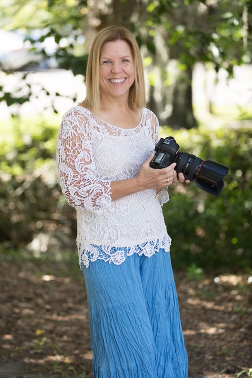 portrait of photographer Susan DeLoach holding camera