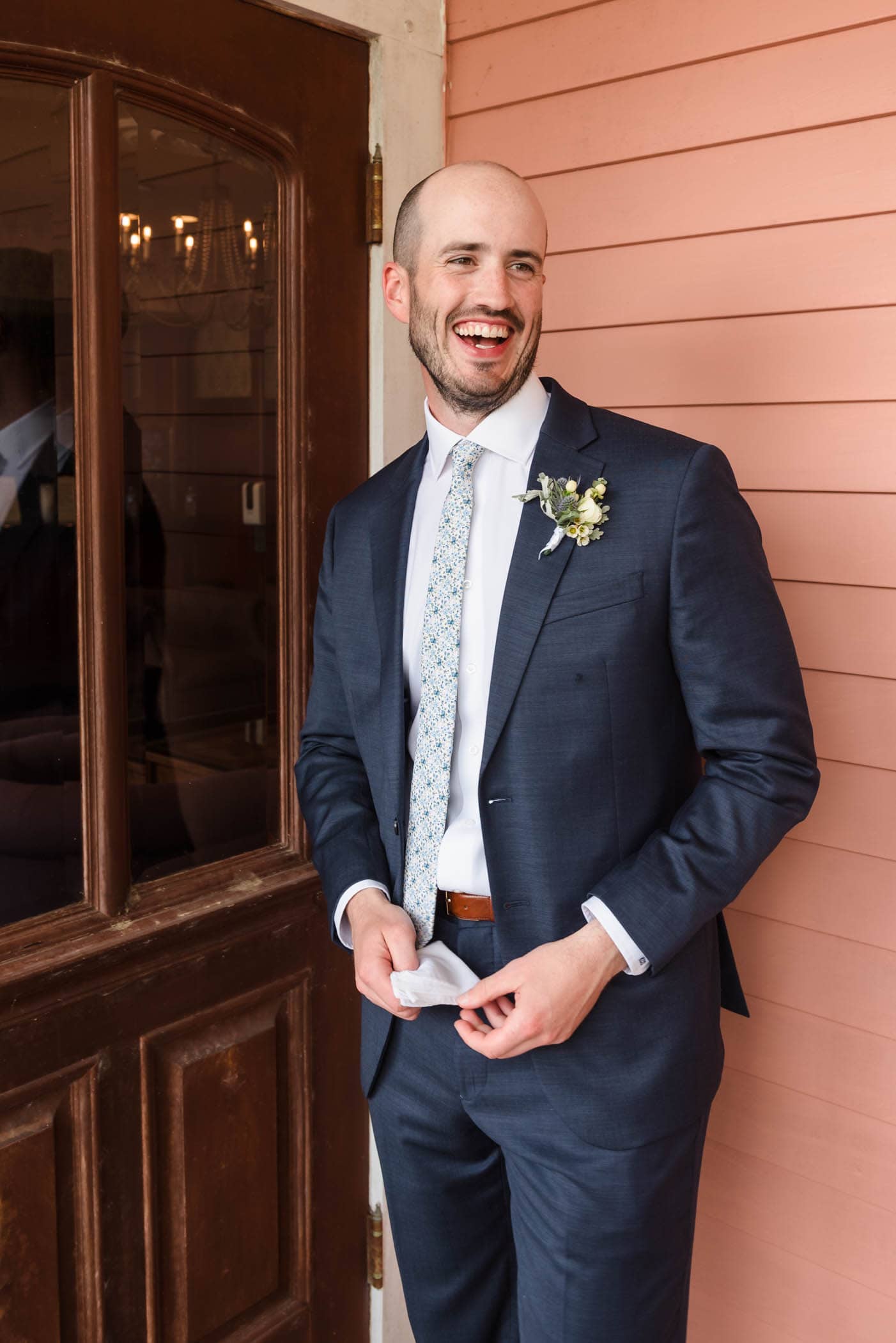 Groom laughing portrait at The Beaufort Inn by Wedding Photographer Susan DeLoach