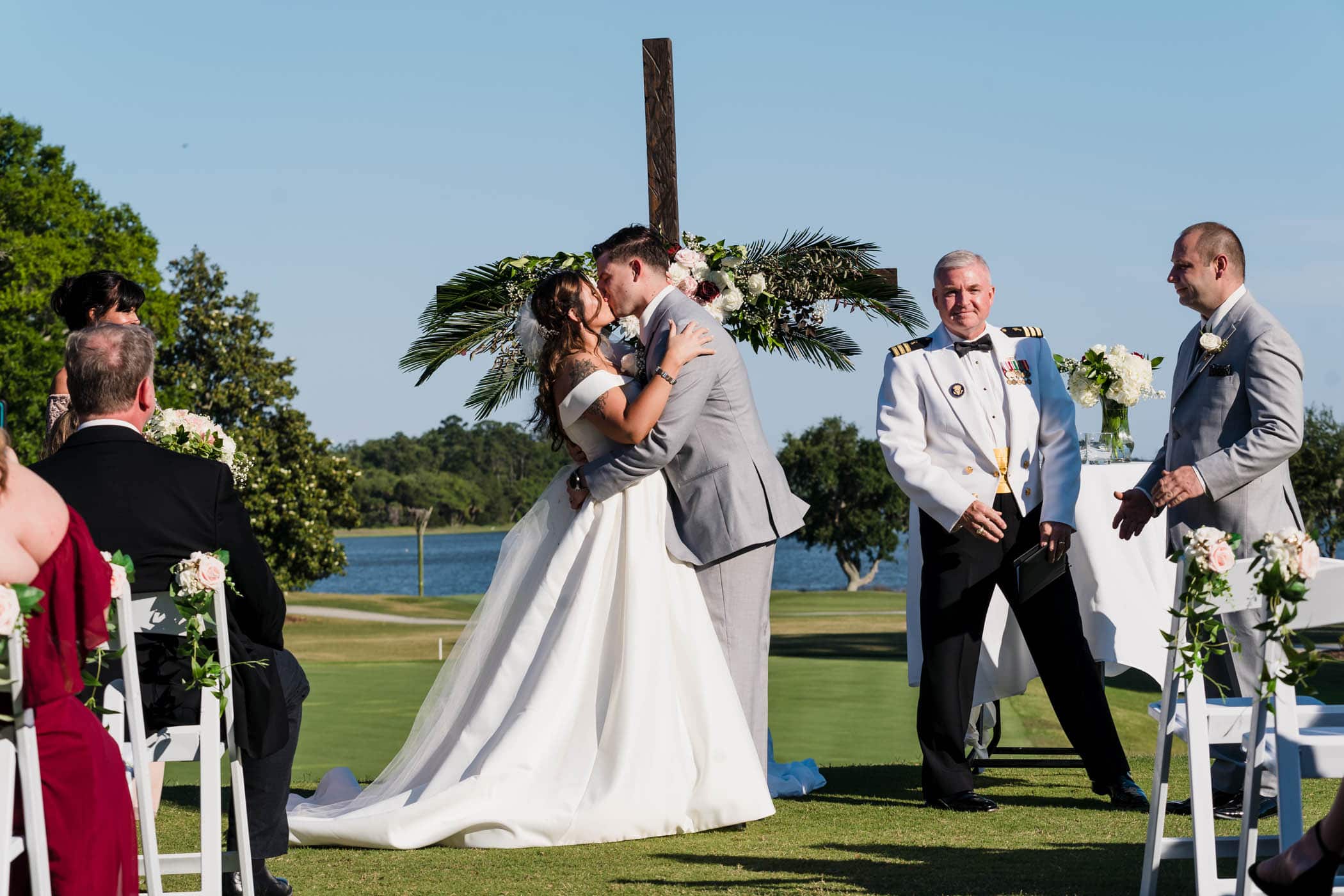 Bride and groom kissing at wedding ceremony Dataw Island Club House by Susan DeLoach Photography SC wedding photographers