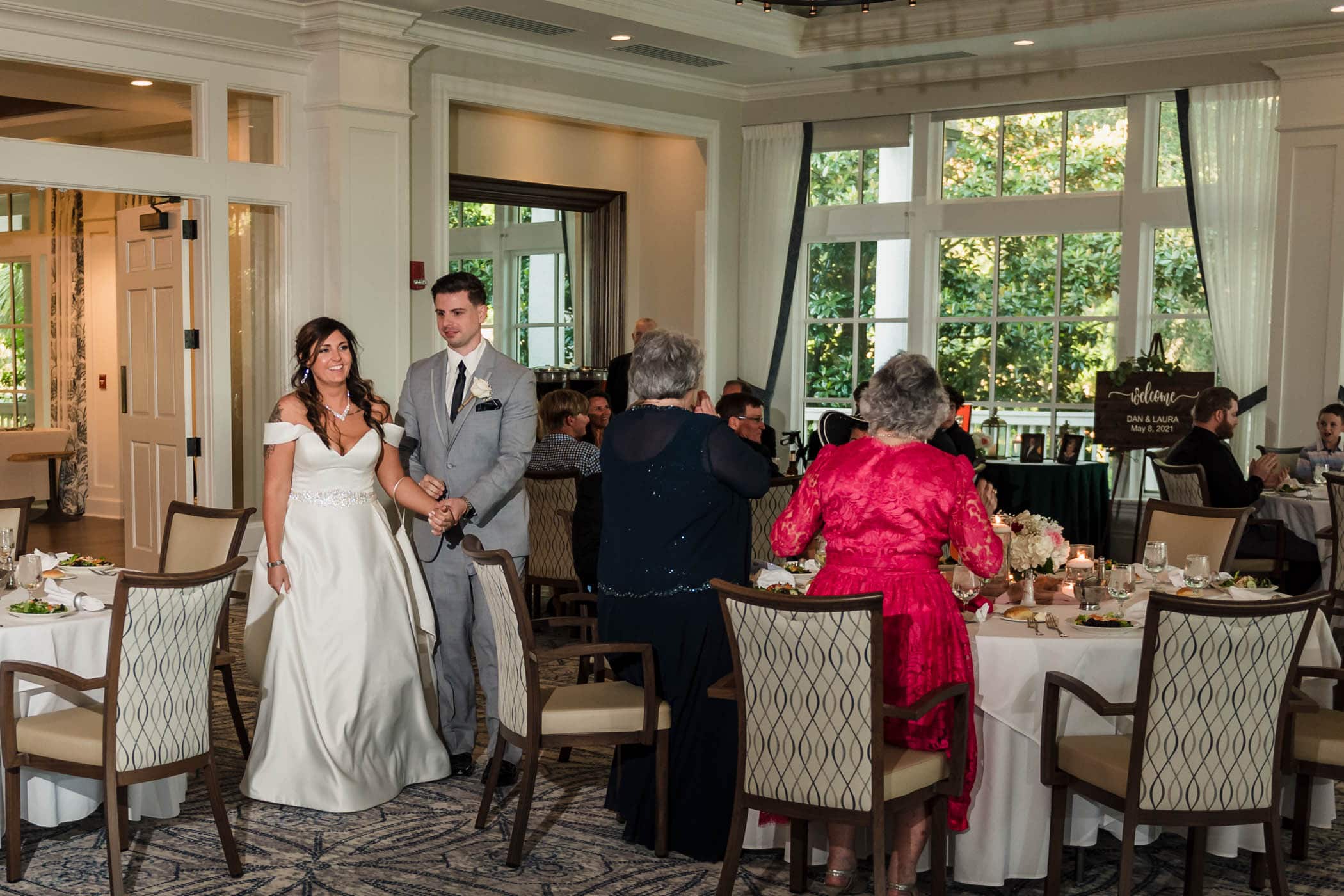 Grand entrance of the bride and groom at the reception Dataw Island Club House by Susan DeLoach Photography SC wedding photographers