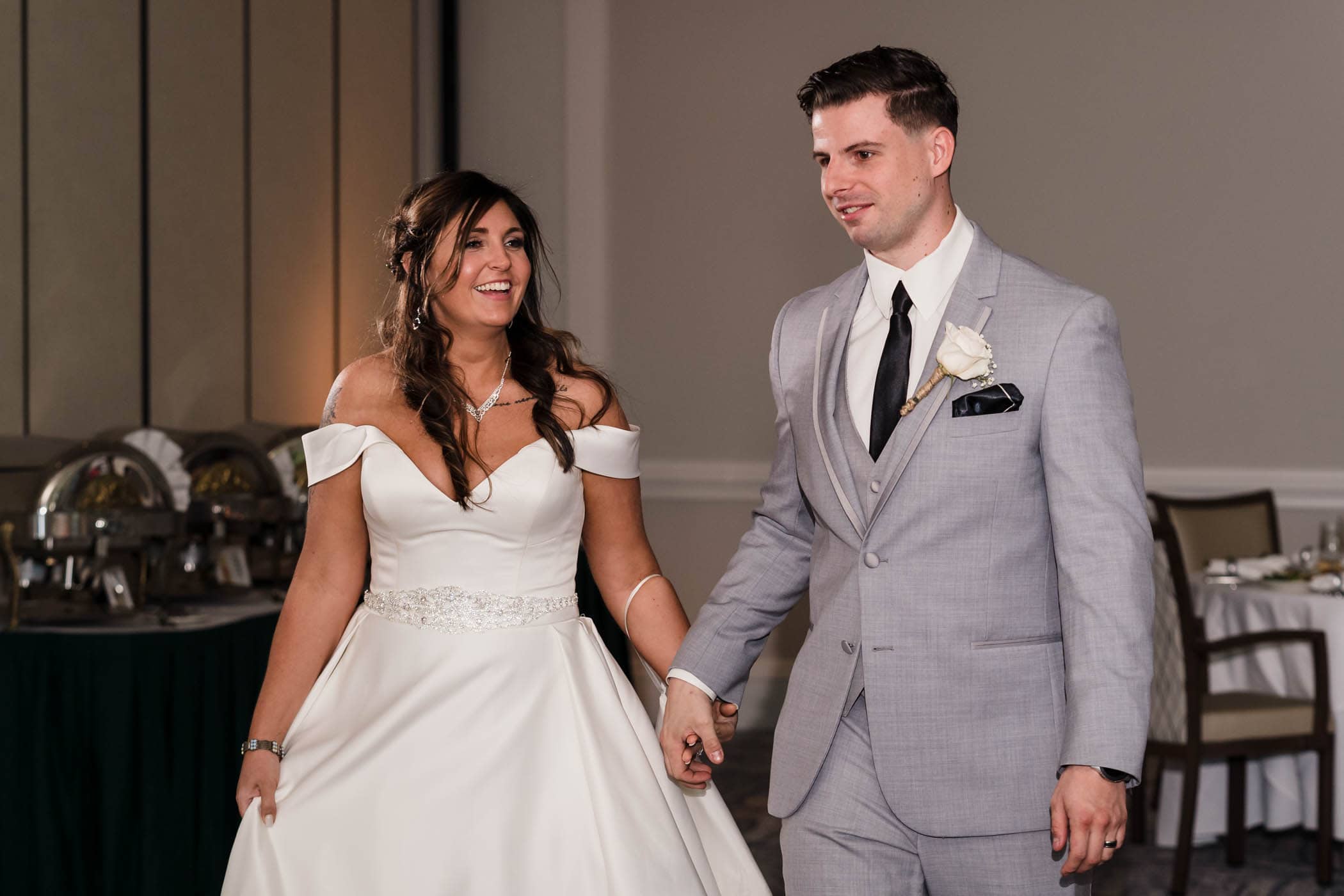 Bride and groom walking into their reception Dataw Island Club House by Susan DeLoach Photography SC wedding photographers