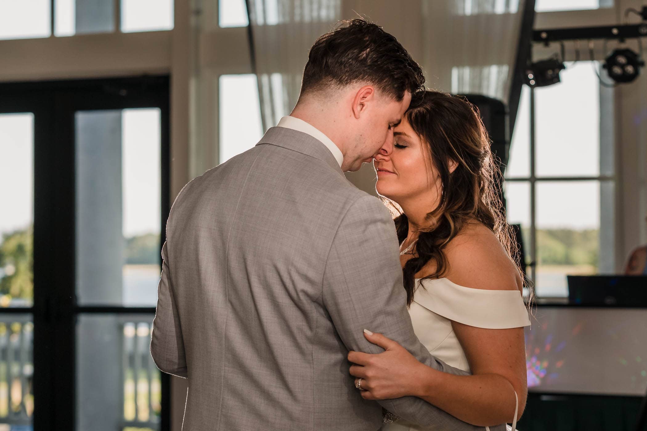 Smiling bride dancing with the groom Dataw Island Club House by Susan DeLoach Photography SC wedding photographers