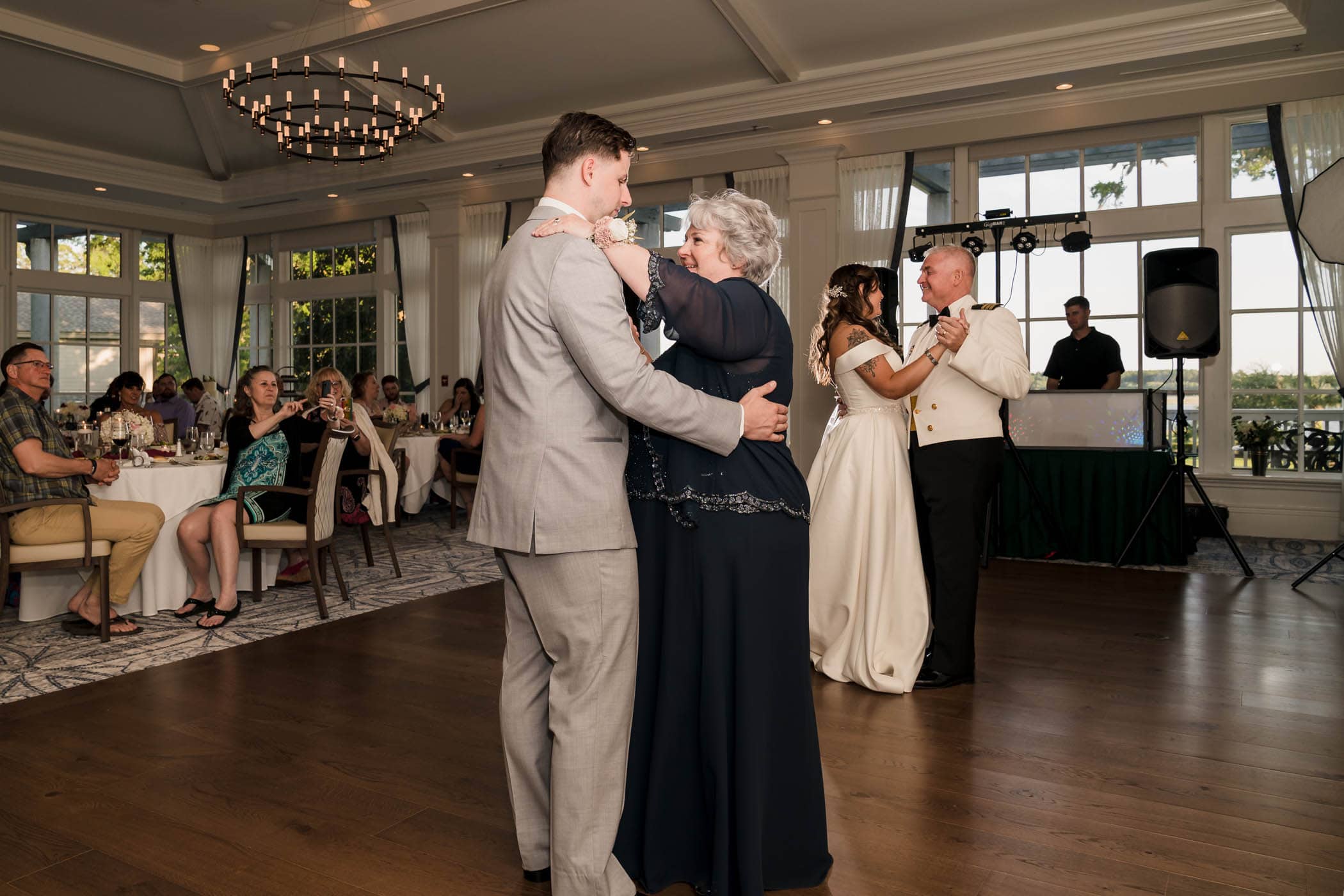 Bride with father, Groom with mother dancing on the dance floor at the same time Dataw Island Club House by Susan DeLoach Photography SC wedding photographers