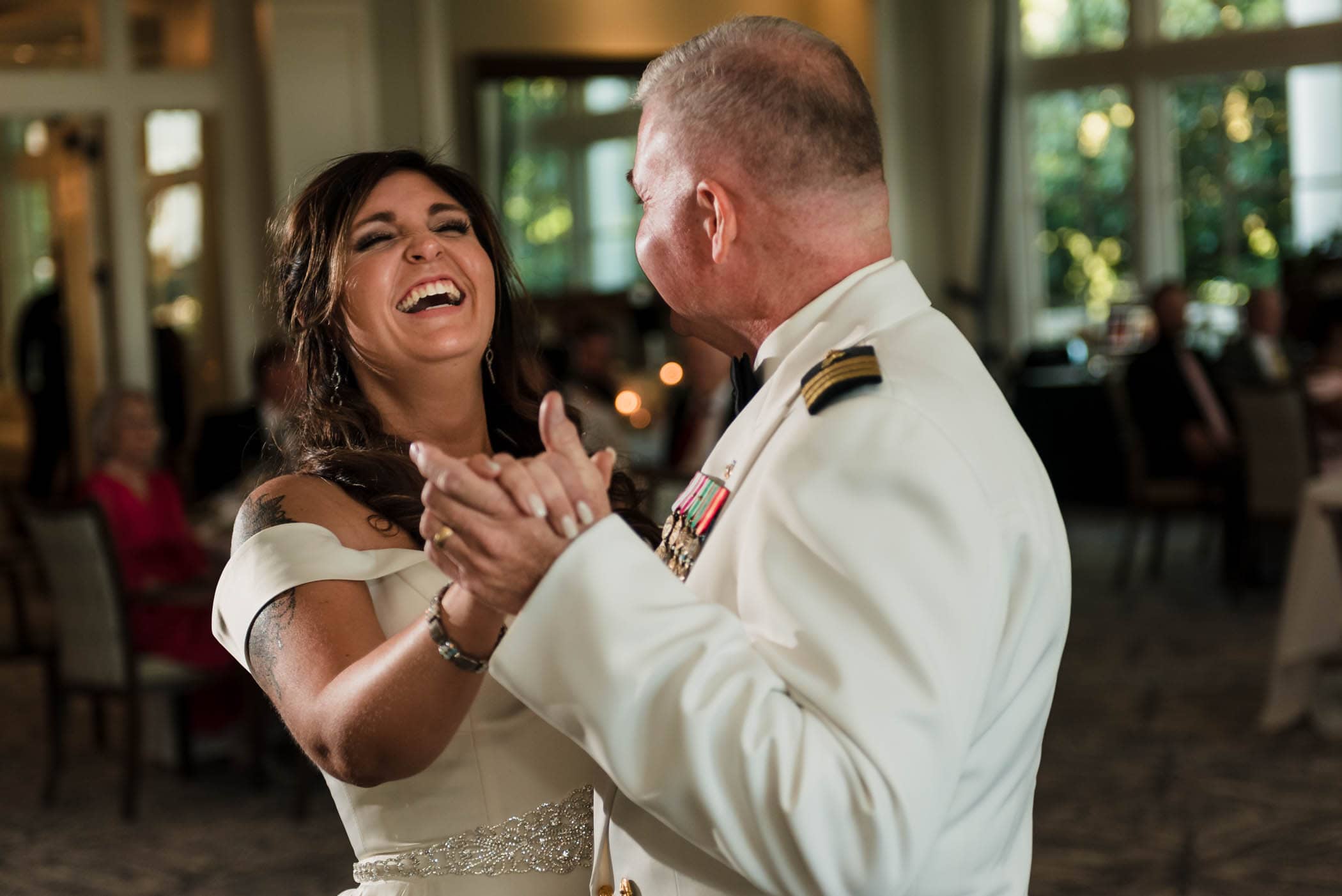 Laughing bride dancing with her father Dataw Island Club House by Susan DeLoach Photography SC wedding photographers