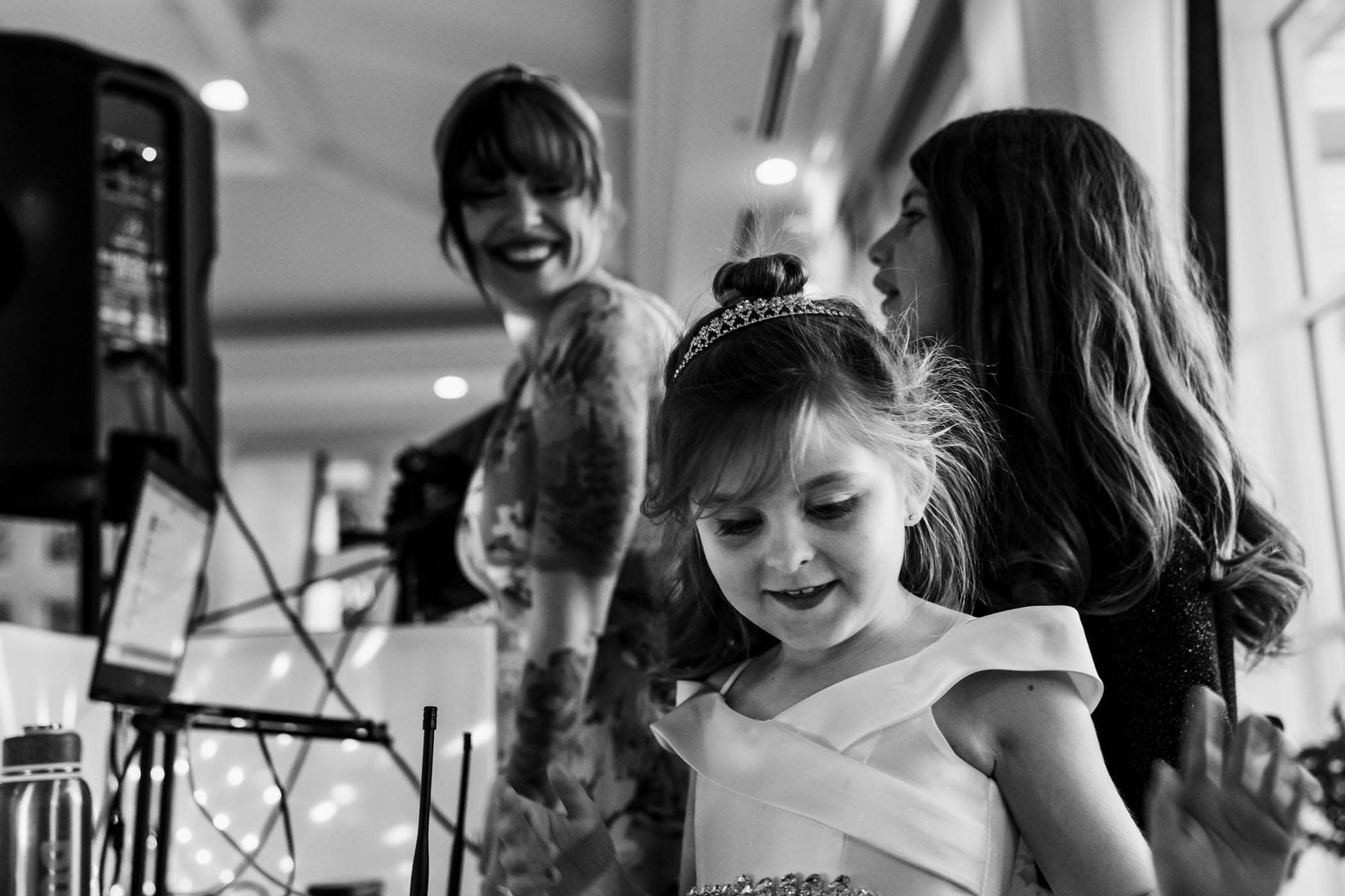 Daughter of the bride and DJ showing them how to turn on dj lights Dataw Island Club House by Susan DeLoach Photography SC wedding photographers