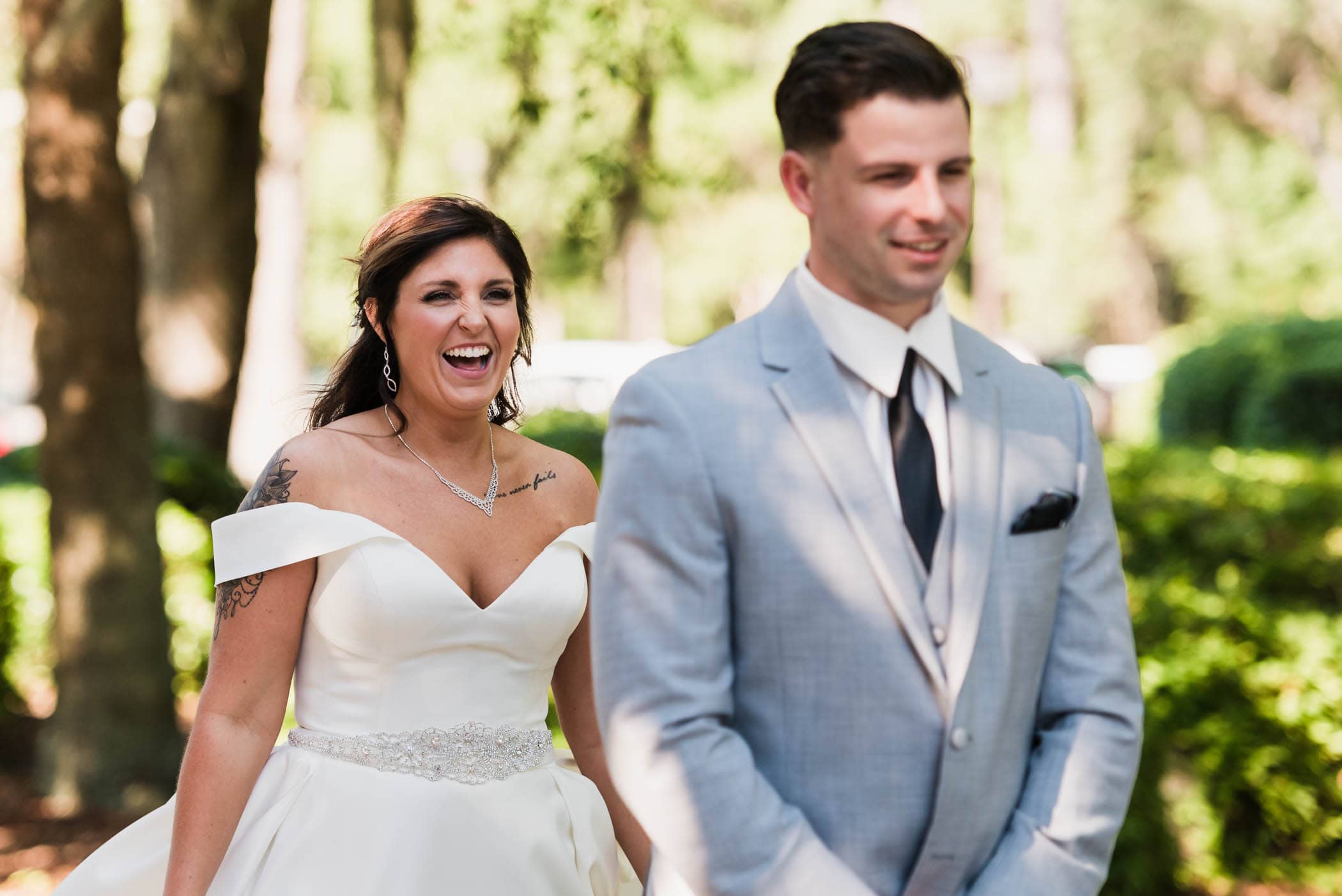 Brides face as she walks up behind her groom for the first look by Susan DeLoach Photography SC wedding photographers